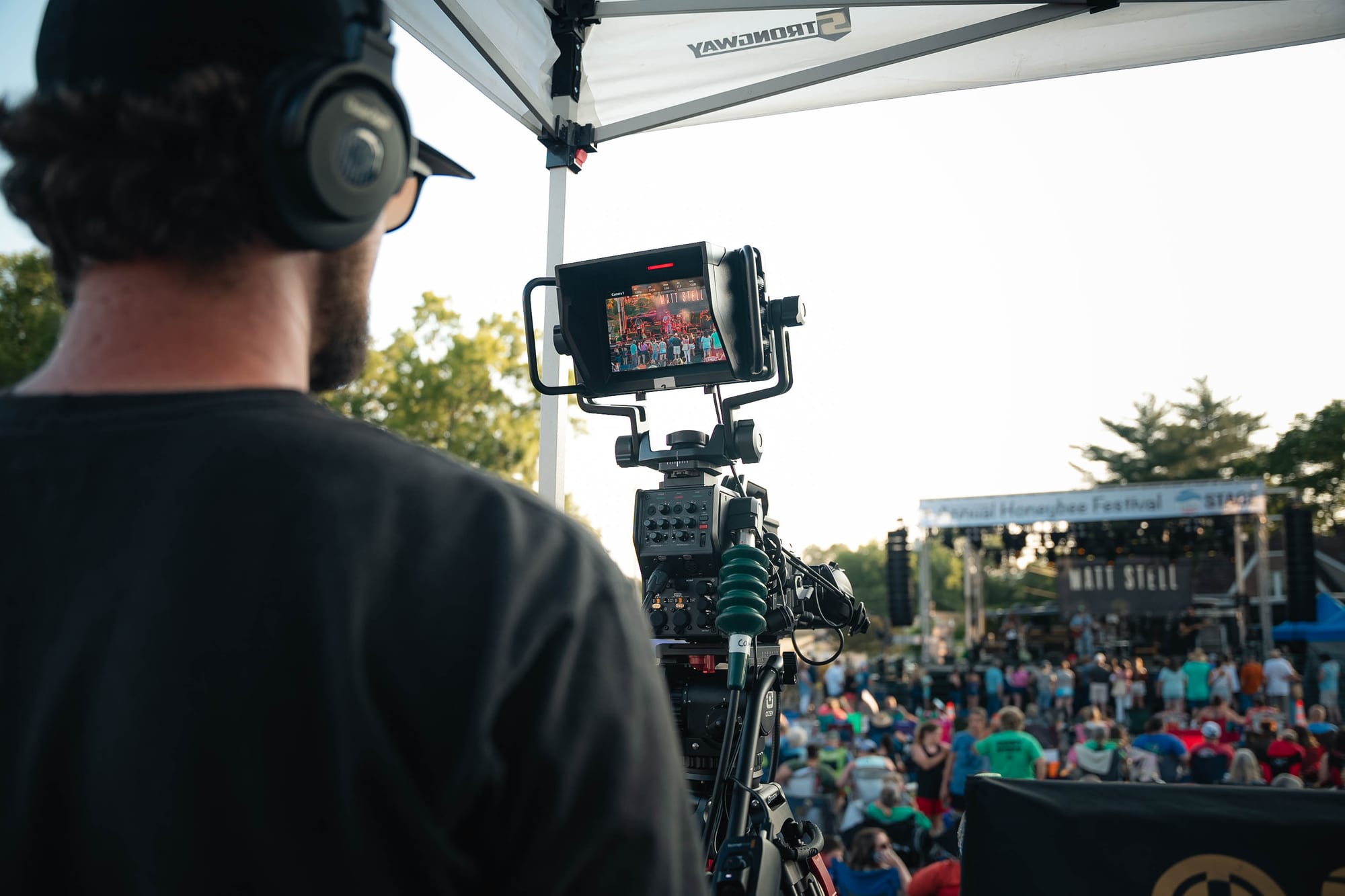 Camera monitor showing the festival crowd and stage