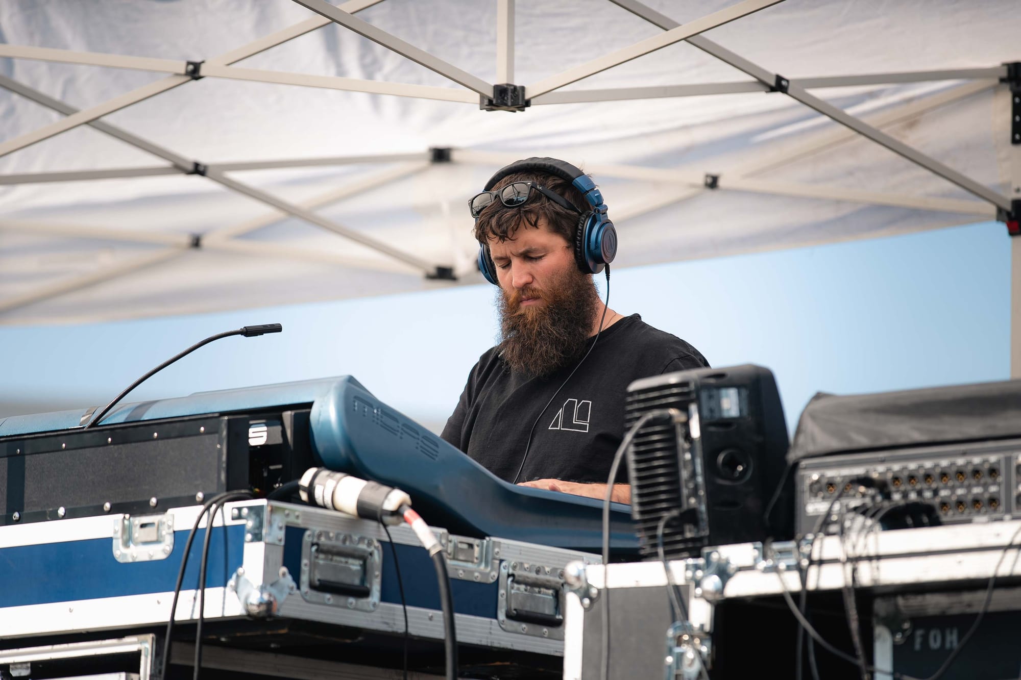 Audio engineer monitoring the mix at front of house