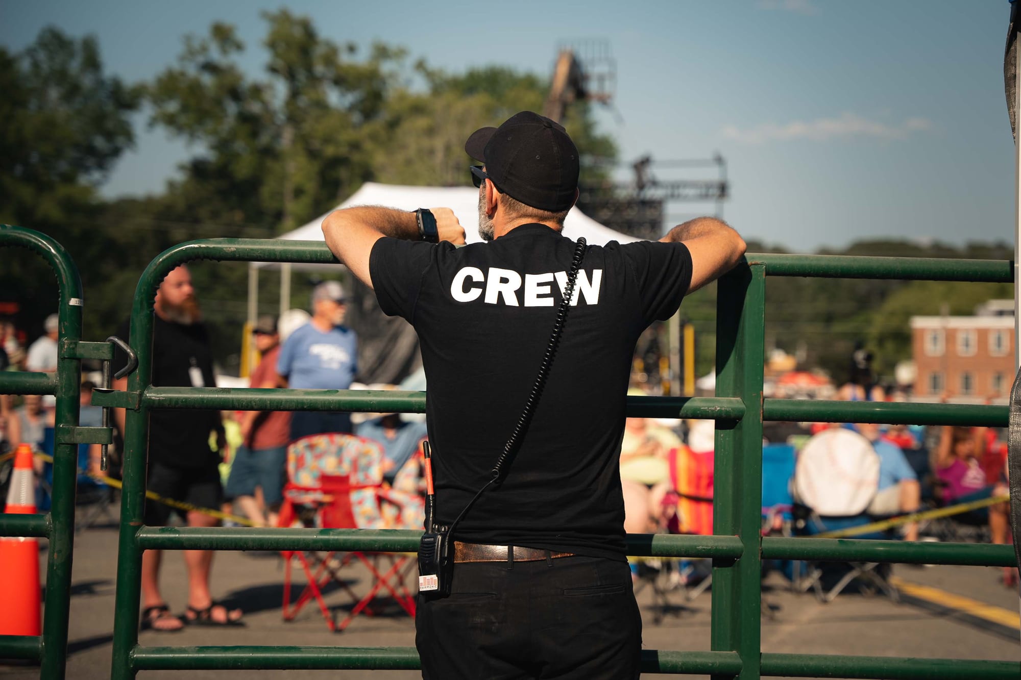 Crew directing a production assistant on stage