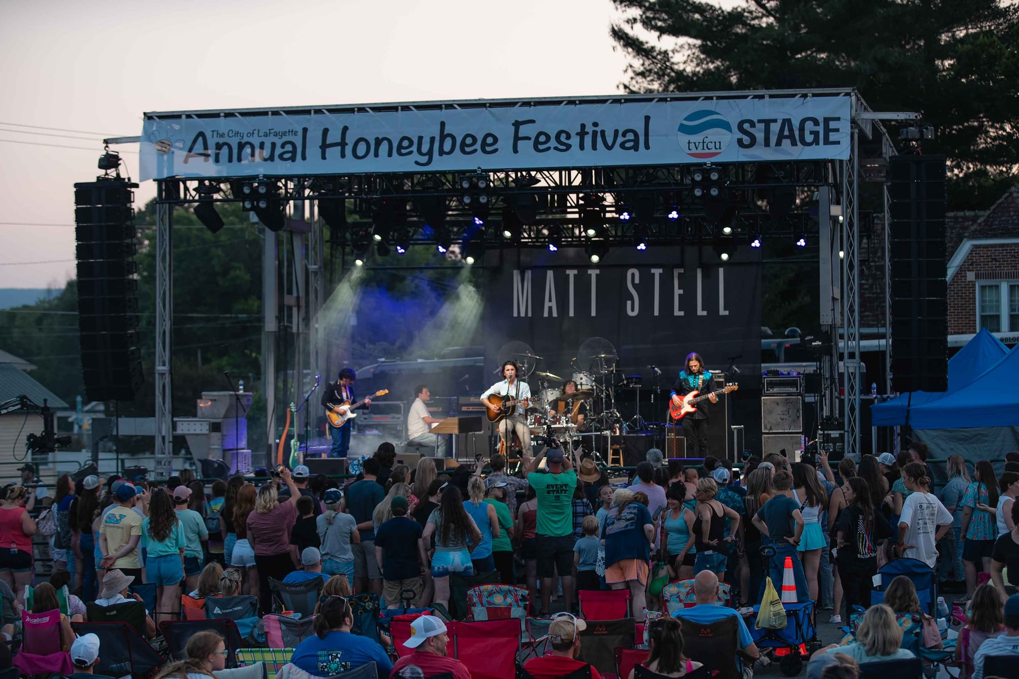 Wide shot of the HoneyBee Festival main stage and crowd