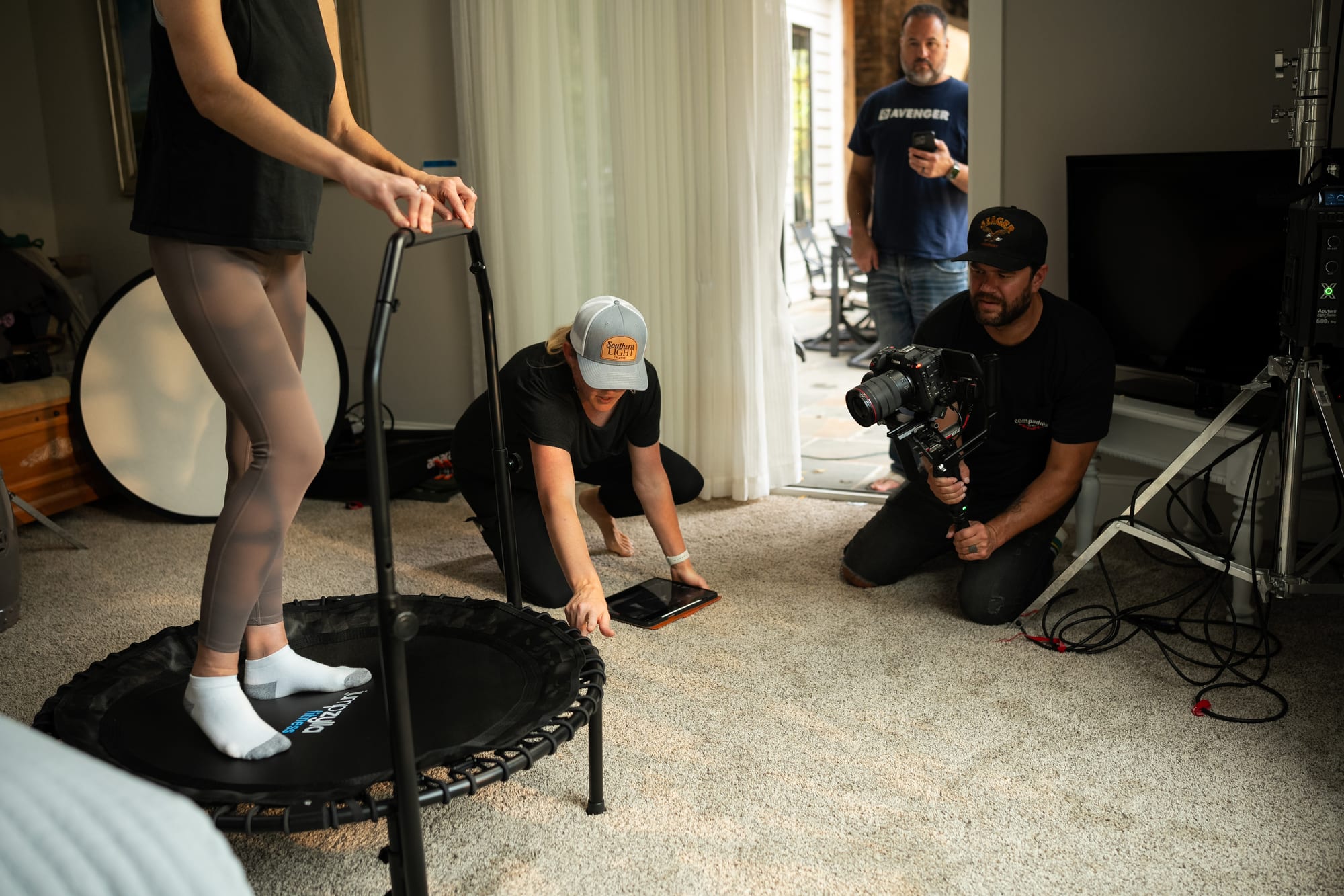 Crew smiling while framing a shot overhead