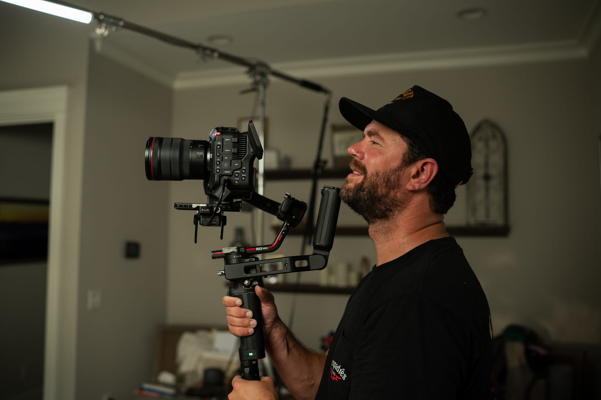 Camera operator smiling with rigged cinema camera