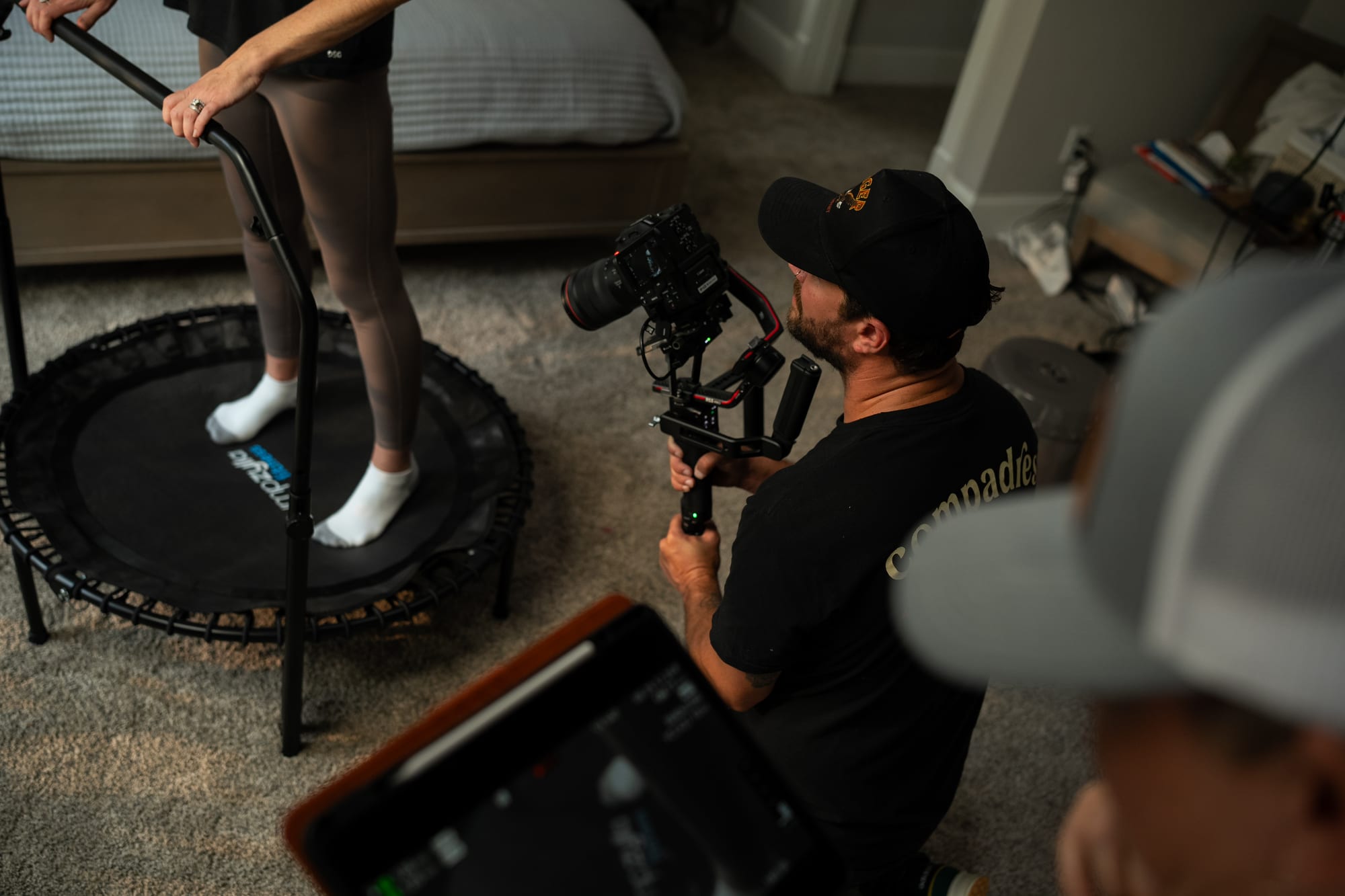 Overhead shot of camera operator filming trampoline talent
