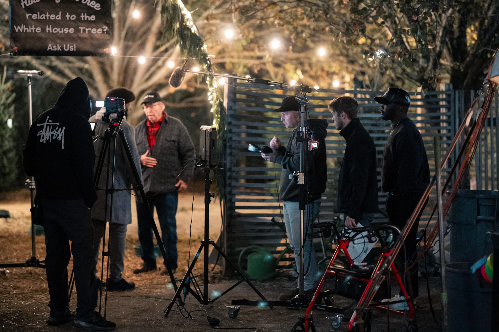 Full crew and cast blocking a scene at the tree lot