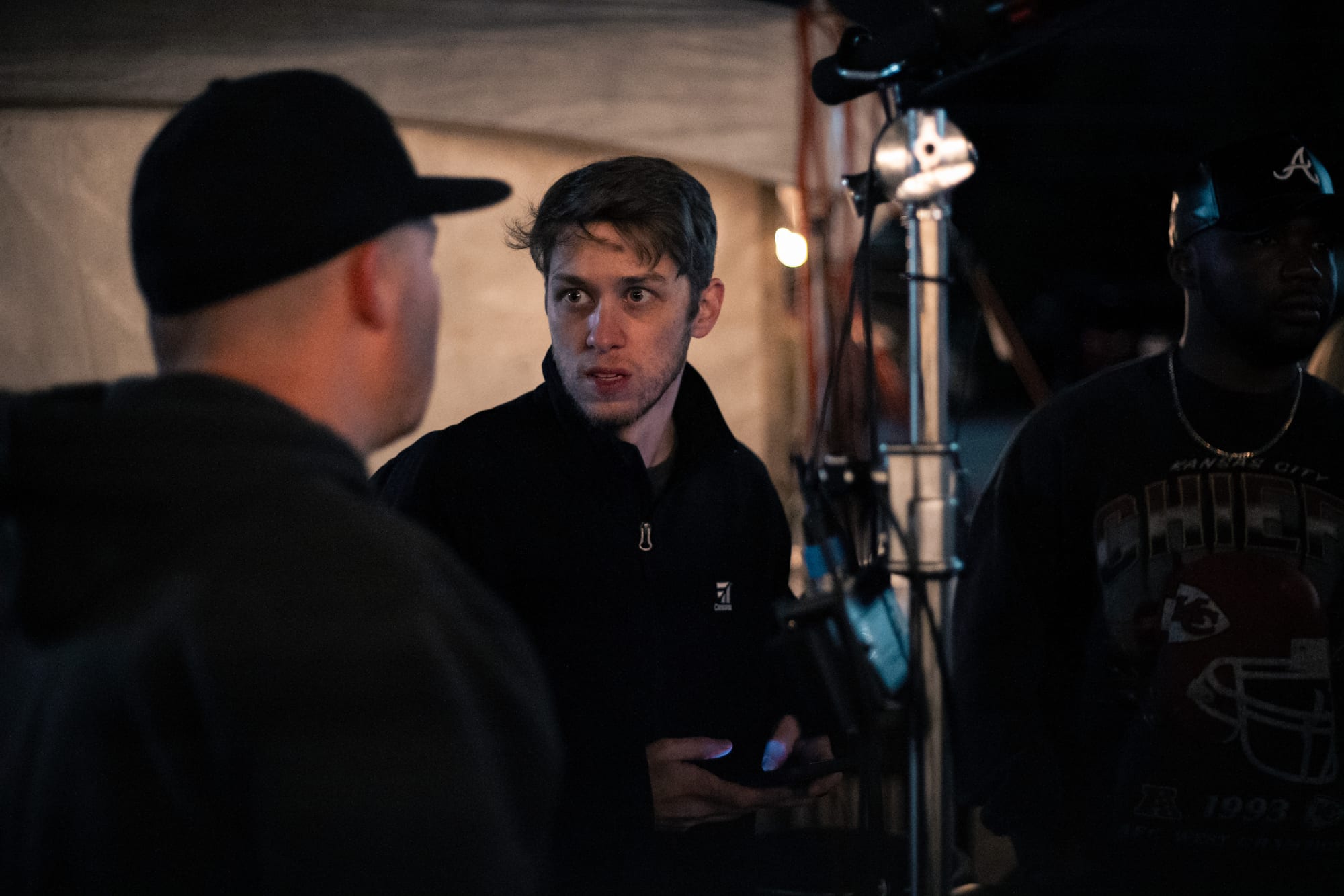 Crew discussing the next setup at night
