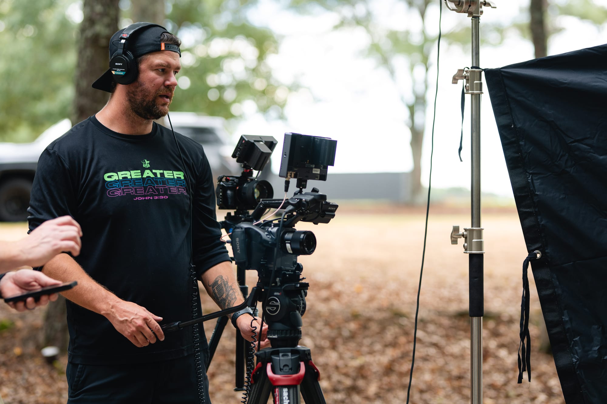 Two crew members reviewing a monitor