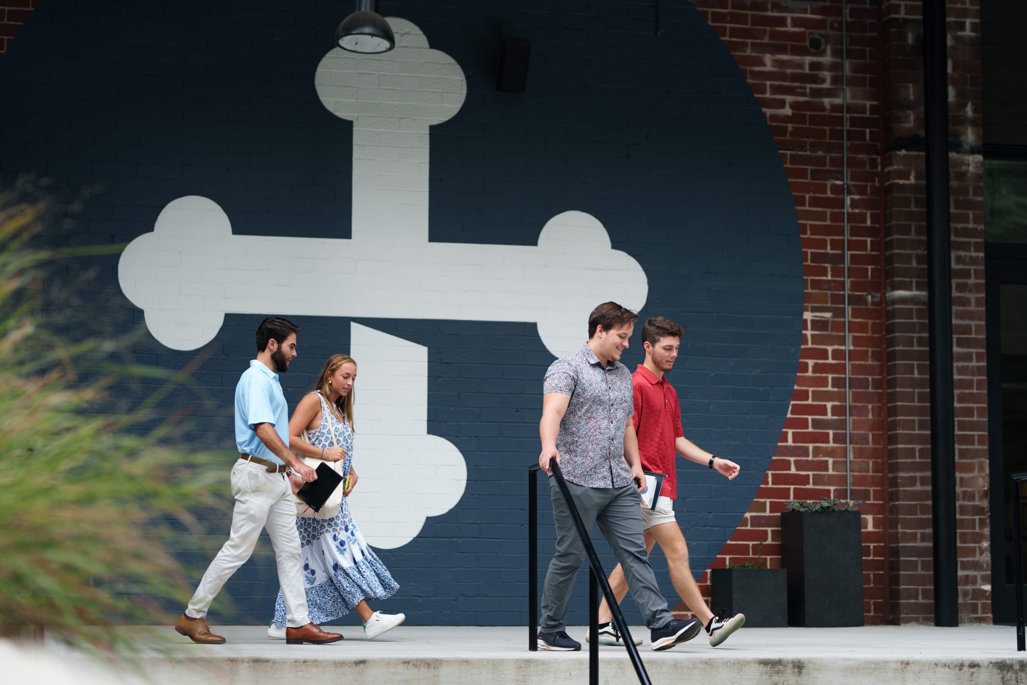 Members walking through courtyard