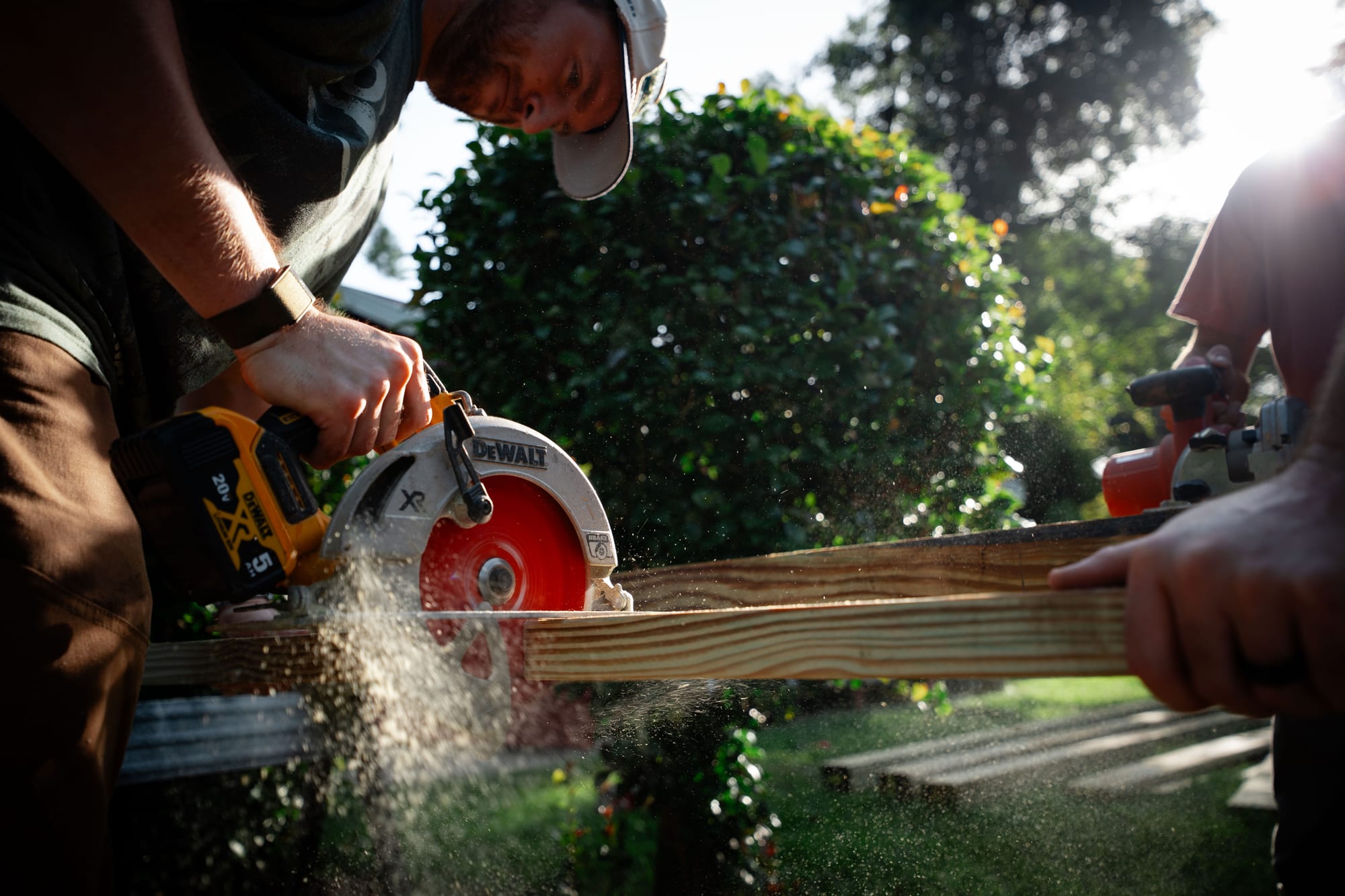 Volunteers building with power tools