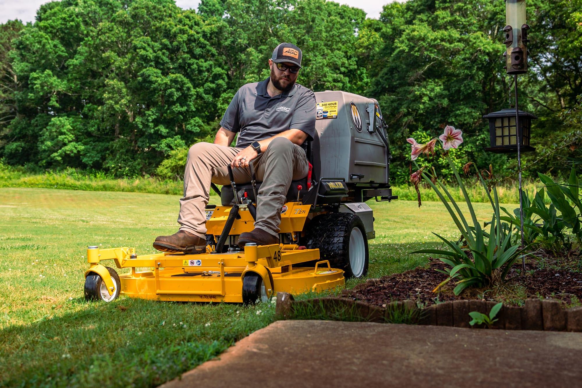 Landscaper on a stand-on mower