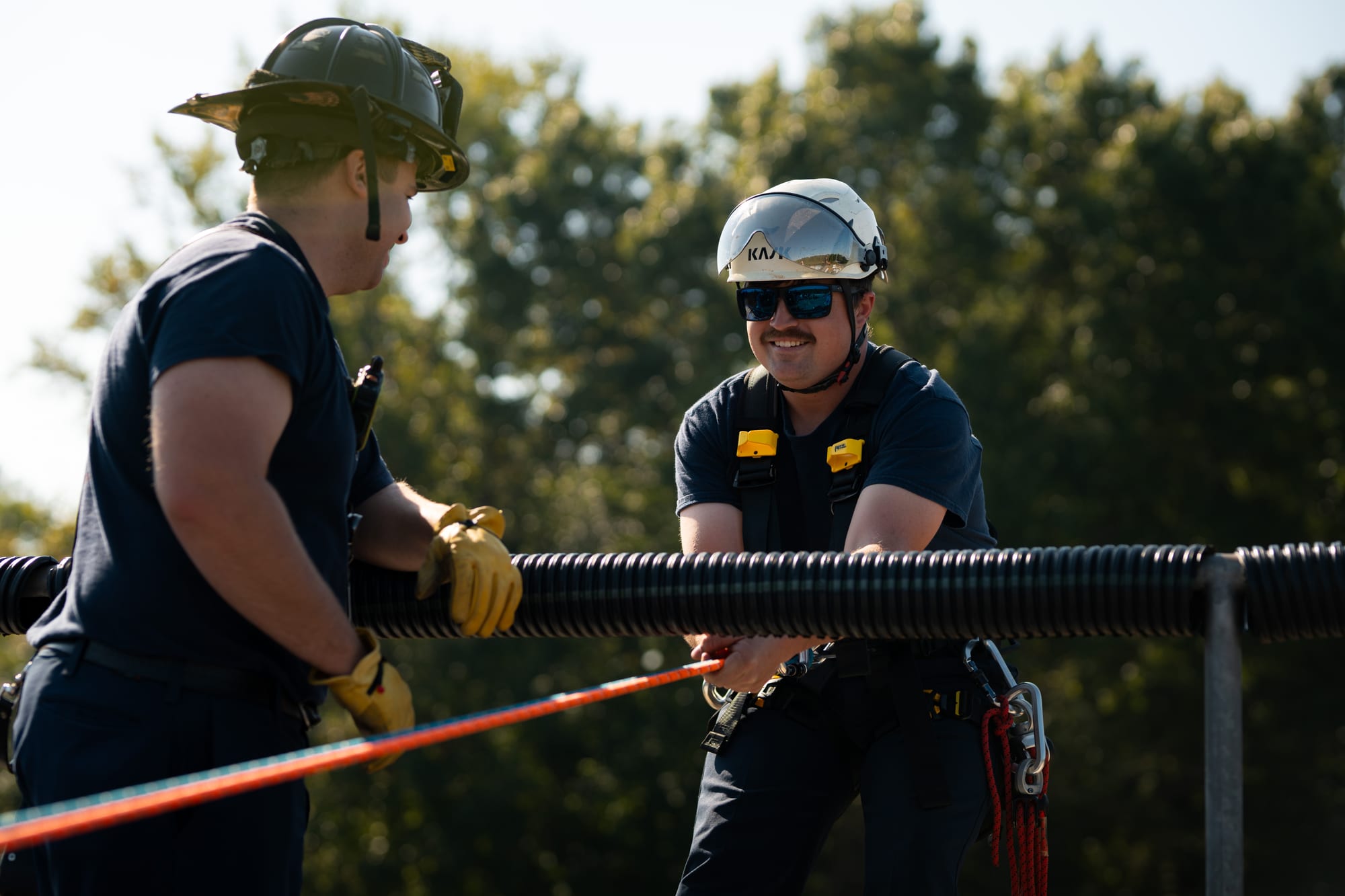 Firefighters training with rope rescue