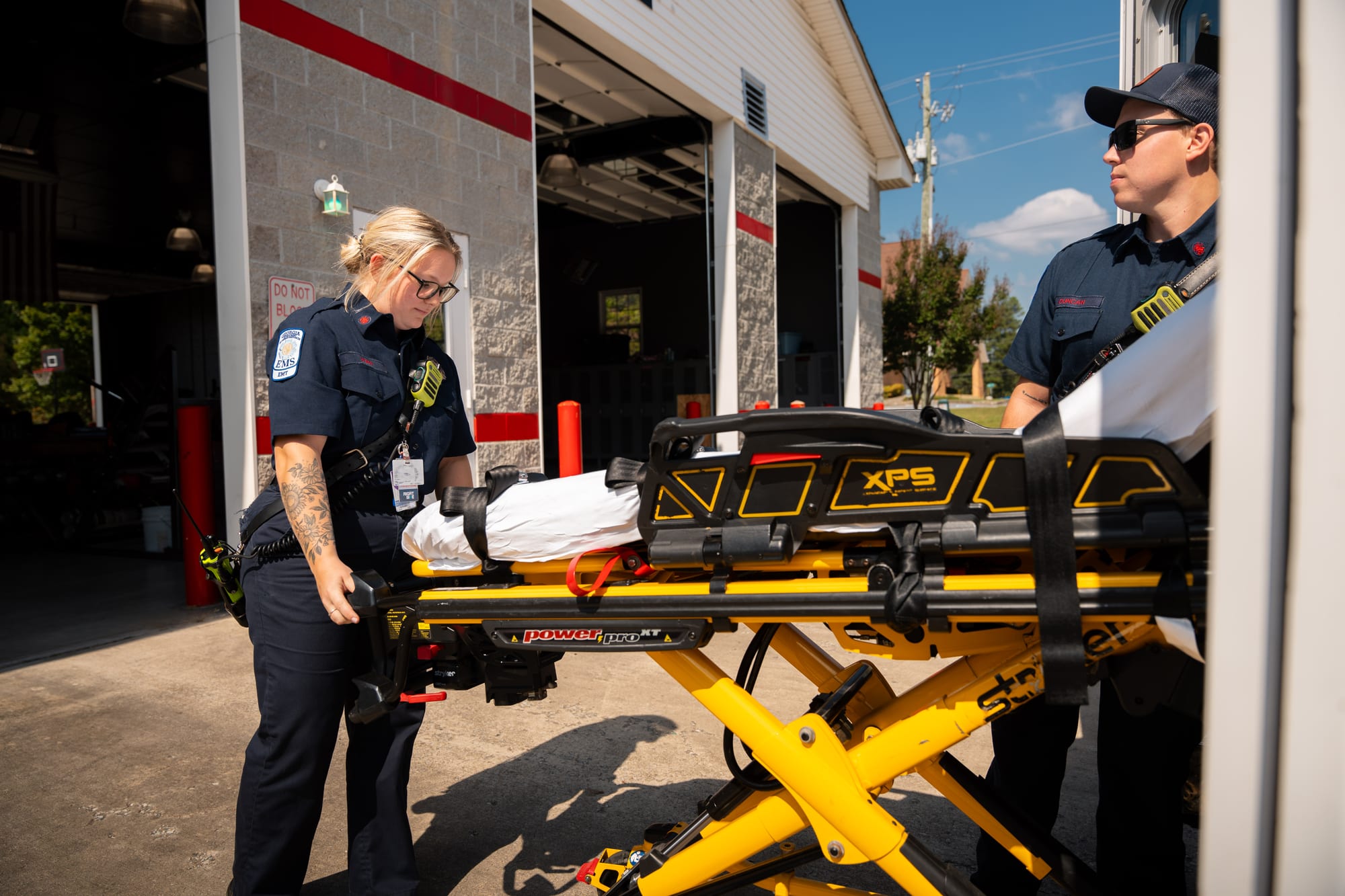 EMS crew with stretcher at station