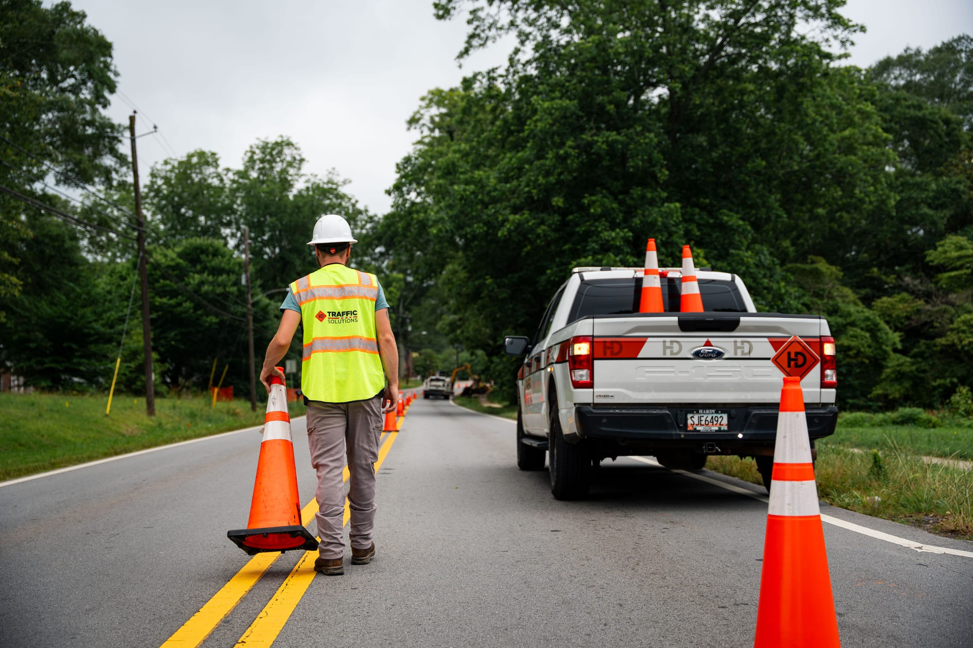 Traffic control technician with cones