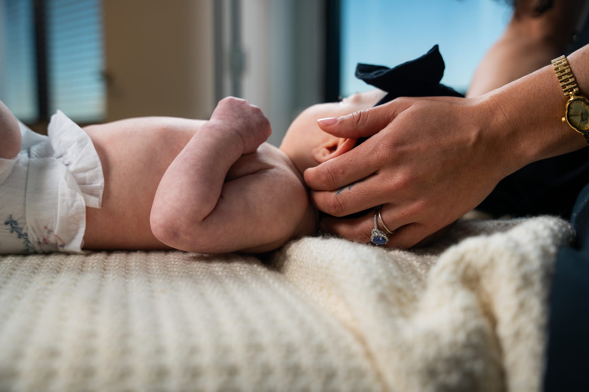 Chiropractor with infant patient detail