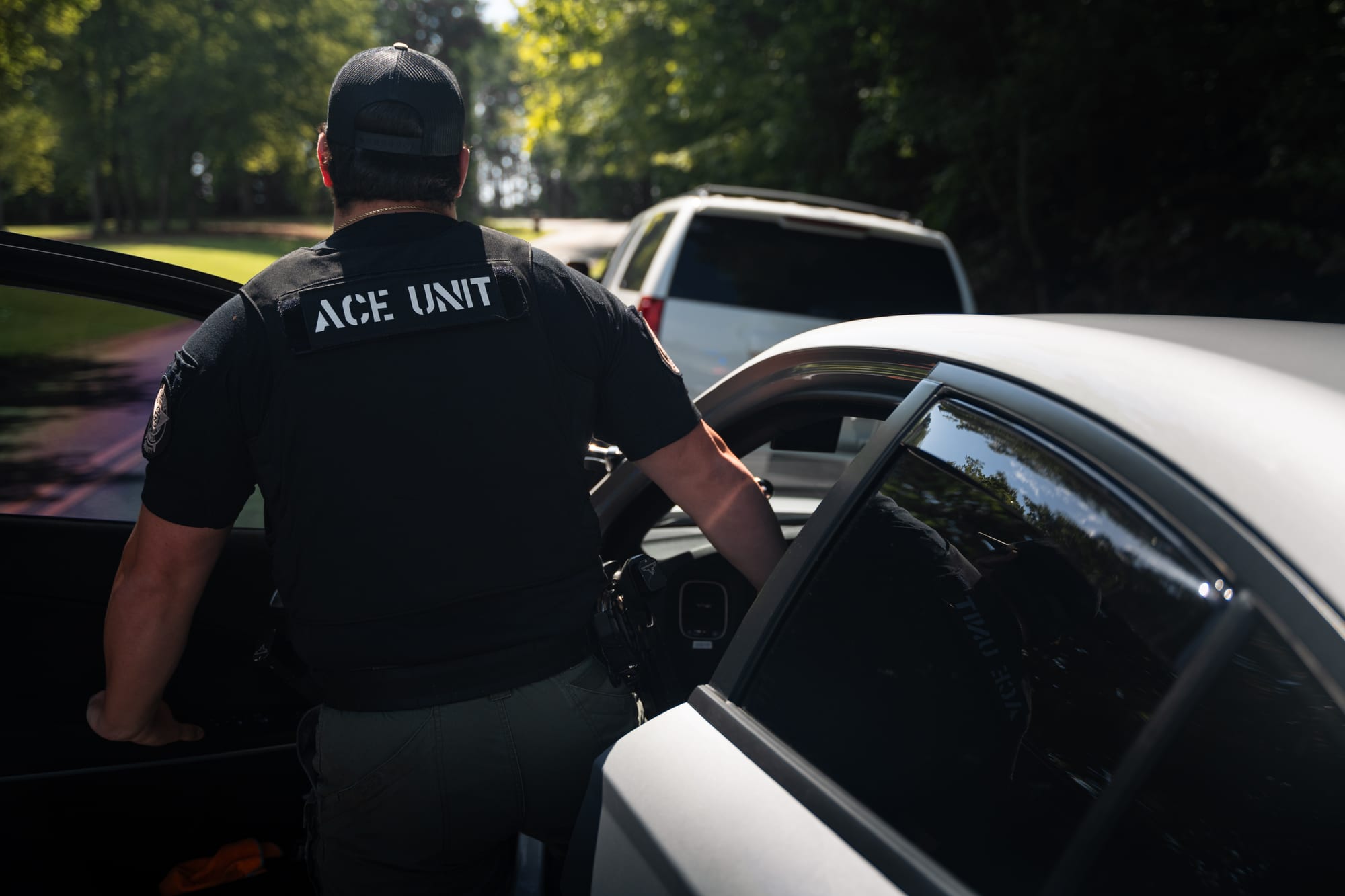 ACE unit deputy at patrol vehicle